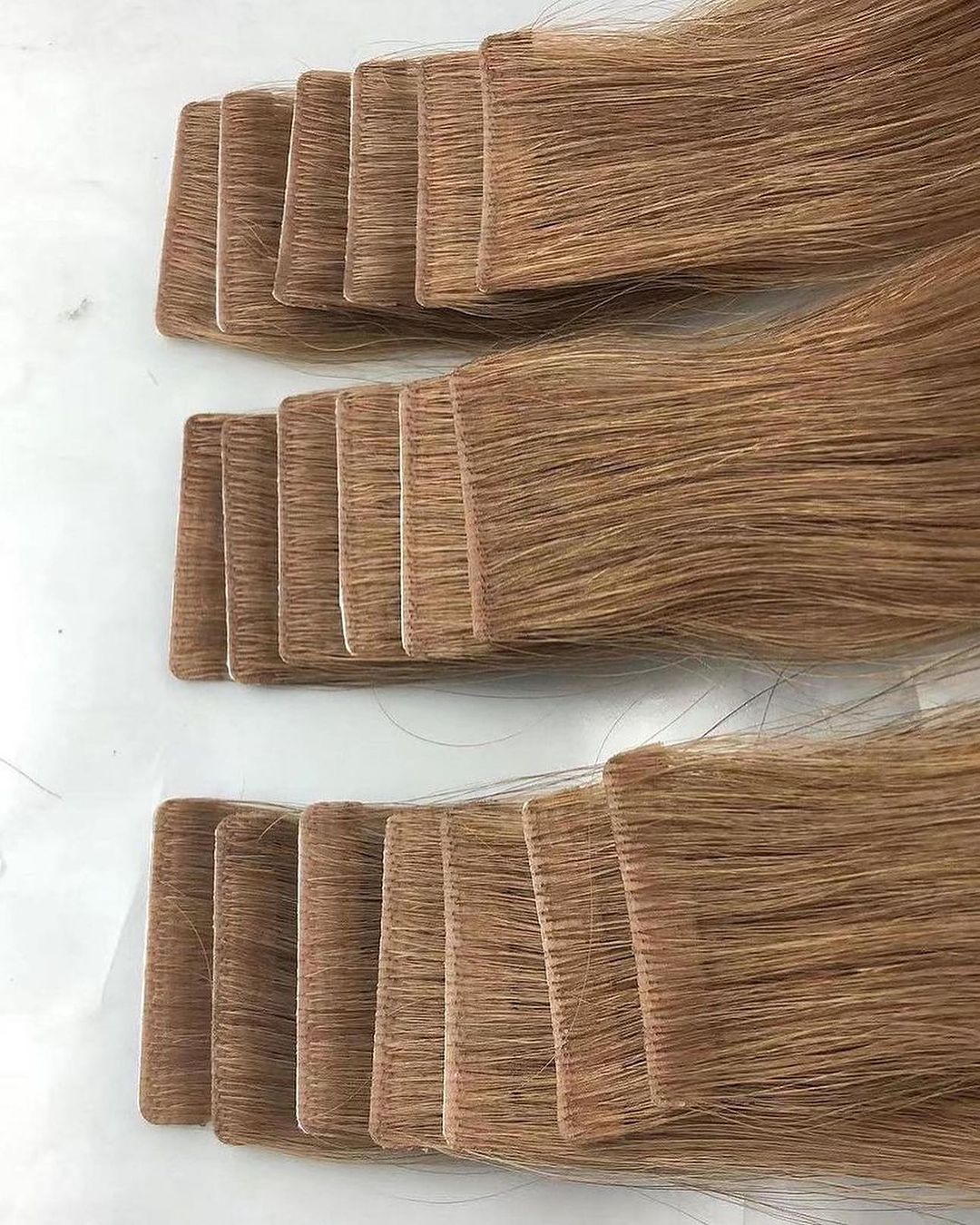 INVISIBLE TAPE IN HAIR EXTENSIONS